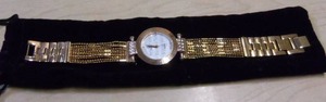 lot 57 image: Burgi Ladies Crystal Diamond Accent and Mother of Pearl Watch
