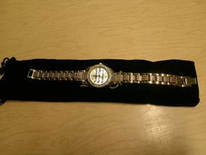 lot 102 image: BURGI LADIES CRYSTAL DIAMOND ACCENT AND MOTHER OF PEARL WATCH