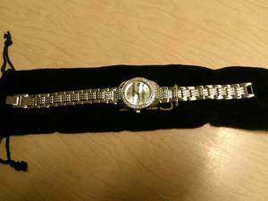 lot 104 image: Burgi Ladies Crystal Diamond Accent and Mother of Pearl Watch