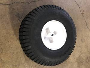 lot 29 image: Powercare Universal 20 in. x 8 in. Rear Wheel Assembly for Lawn Tractors and Zero-Turn Mowers Customer Returns See Pictures