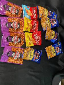 lot 76 image: Y1 - Assorted Packaged Snacks Including Pretzels, Onion Rings, and Cheese Snacks
