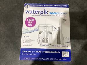 lot 693 image: Waterpik Ultra Plus and Cordless Express Water Flosser