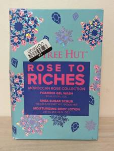 lot 170 image: Tree Hut Holiday Rose to Riches Gift Set  Limited Edition  Includes Tree Huts Signature Shea Sugar Scrub, Foaming Gel Wash, and Moisturizing Body Lotion