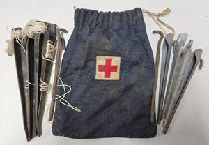 lot 94 image: Vintage WW1 era Red Cross Medical Tent Stake Satchel wStakes