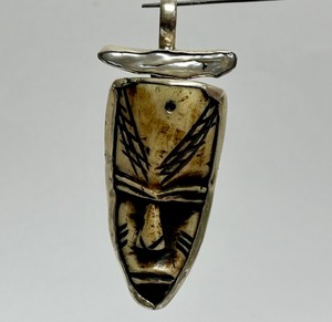 lot 34 image: Vintage Carved Bone & Sterling Silver Face Pendant