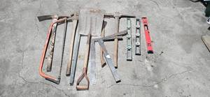 lot 22 image: Collection of Hand Tools Including Shovels, Saws, and Levels