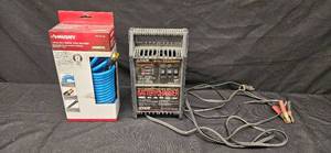 lot 82 image: Husky Poly Air Hose and Exide 12 Volt Battery Charger
