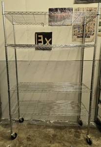 lot 150 image: Heavy-Duty 4-Tier Wire Storage Shelving Rack with Wheels