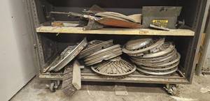 lot 163 image: Collection of Automotive Wheel Covers and Various Parts