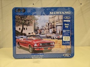 lot 176 image: 1000-Piece Ford Mustang Race Day Puzzle in Collectors Tin - number of pieces unverified