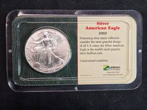lot 24 image: 2002 Uncirculated American Eagle Silver Coin