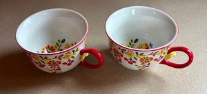 lot 39 image: Anthropologie Cadiz Flowers Floral Teacup Set with Red Handles