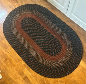 lot 109 image: Vintage Braided Oval Rug