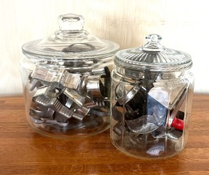 lot 62 image: Vintage Cookie Cutters in Glass Canisters