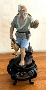 lot 120 image: Asian Mud Man Figurine