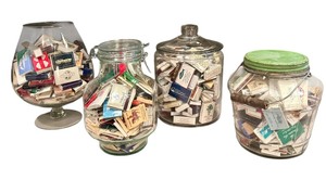 lot 67D image: Four Glass Containers Full of Match Books