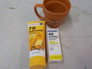 lot 134 image: Gardener Coffee Cup and Sunscreen...