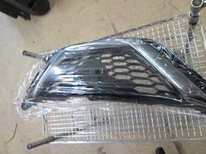 lot 117 image: looks like a grill for a nissan car...