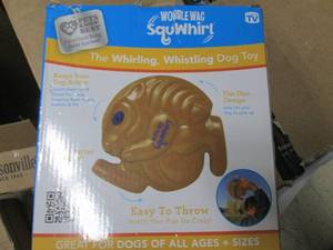lot 199 image: the whirling whistling dog toy...