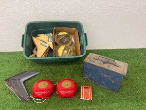 lot 132 image: Tote of Misc - Shelf Brackets, Ammo Box, Striping Tape & Fire Bells