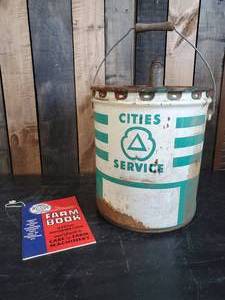 lot 23 image: Large Cities Service Oil Can With Useful Information Guide