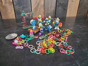 lot 54 image: Vintage Smurfs Lot, Schleich 1983  Smurfette, Clown, Cowgirl, and More along with other Misc vintage Items