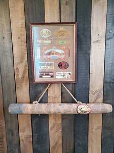 lot 72 image: Vintage Framed Cigar Lables with Large Wooden Cigar.  Perfect Display