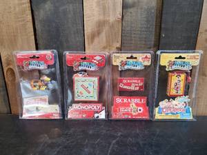 lot 73 image: 4 Vintage Worlds Smallest ToyGame replicas in orginal Packaging never used, Slinky Dog, Scrabble and others