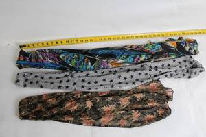 lot 147 image: Collection of 3 Fashionable Scarves Floral, Starry, and Feather Motif
