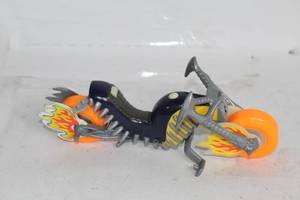 lot 324 image: Flame-Themed Toy Motorcycle with Orange Wheels