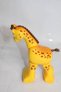 lot 336 image: Yellow Giraffe Wind-Up Toy with Rolling Wheels