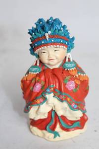 lot 386 image: Hand-Painted Decorative Figurine in Traditional Outfit