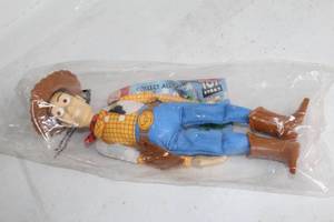 lot 399 image: Factory-Sealed Toy Story Woody Burger King Promotional Toy