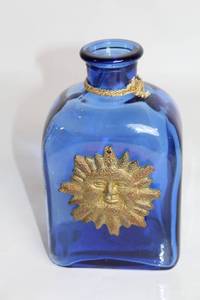 lot 443 image: Blue Glass Square Bottle with Sun Emblem