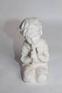 lot 463 image: Vintage White Ceramic Boy Figurine Playing Flute