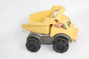 lot 465 image: Yellow Toy Dump Truck with Doll Driver