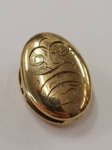 lot 19M image: Antique 10K Gold Oval Clip with Steel Spring
