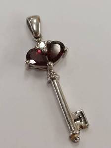 lot 209M image: Sterling Silver Key Pendant with Red Gemstones