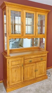 lot 19 image: Two Piece Cochrane Lighted Oak Hutch