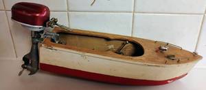 lot 145 image: Vintage Electric-Powered Wooden Toy Boat w International Models Inc. Outboard Motor DC Powered