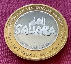lot 24 image: Sahara Las Vegas $10 Silver Strike Gaming Token