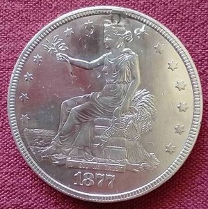 lot 90 image: Awesome 1877 Trade Dollar