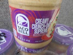 lot 596 image: 16- 15 oz Taco Bell Creamy Crunch-D...