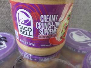 lot 597 image: 16- 15 oz Taco Bell Creamy Crunch-D...