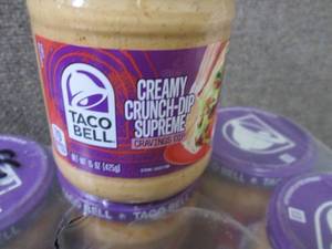 lot 599 image: 16- 15 oz Taco Bell Creamy Crunch-D...