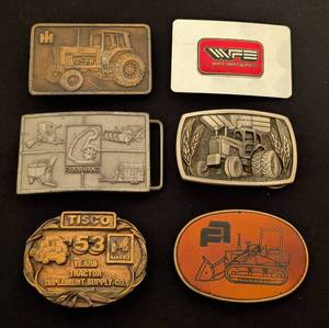 lot 124 image: Six Vintage Farm Advertising Belt Buckles