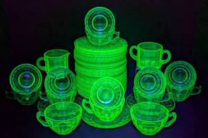lot 53 image: Anchor Hocking Block Uranium Glass Teacups and Bread Plates