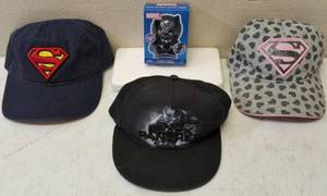 lot 18 image: His & Her Superman Hats & Black Panther Hat & Jumbo Jiggly  View Photos
