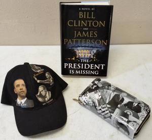 lot 33 image: A Hat, a Wallet & a Novel (View Photo)