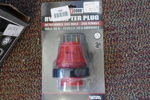 lot 504 image: Mighty Cord RV Adapter Plug 30A